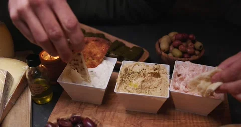 Pitas Dipping in Spreads in Slow Motion Video stock 274774349