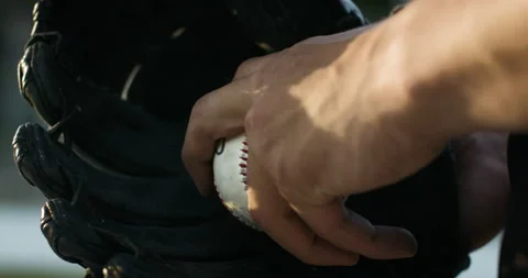 Pitcher finding grip on ball before throwing perfect strike. Stock Footage 132445294