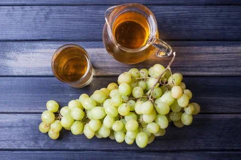 Pitcher of grape juice top view Stock Photos