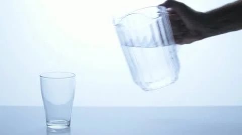 Pitcher pouring into a glass 2 Stock Footage 11611154