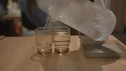 Pitcher pours water Stock Footage 223571239