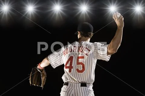 Pitcher throwing baseball Stock Photos