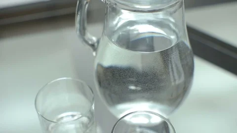 Pitcher of water on the table in a modern apartment Stock Footage 73750757