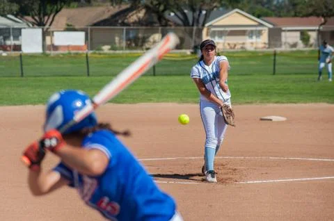 Pitcher in white putting spin on the ball Stock Photos