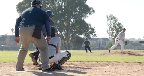 On pitcher's wind-up, stealing home plate, Asian runner diving at baseball field Stock Footage 338325275