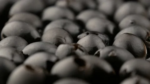 Pitted black olives, side view. Video stock 143815084