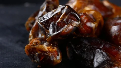 Pitted dates on black background Stock Footage 87220952