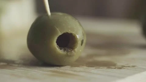 Pitted green olive pick with toothpick appetiser healthy natural organic food Stock Footage 271060697