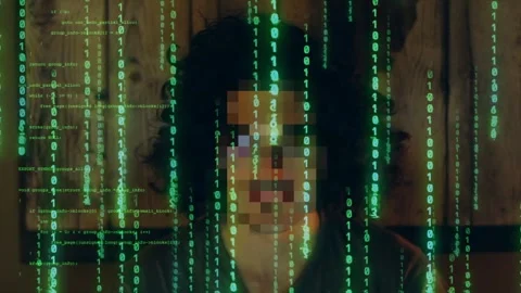 Pixelated face of an unknown hacker with green binary code overlay. Video stock 285825415