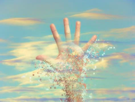 Pixelated hand dissolving in sky Foto stock