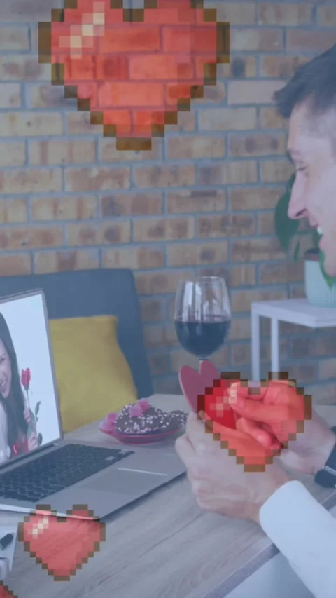 Pixelated heart over caucasian man holding heart shaped placard while having a Stock Footage 331630581