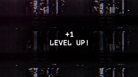 Pixelated Level Up Text on Retro Glitch Digital Screen Stock Footage 339632205