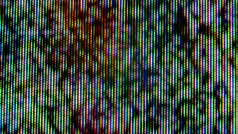Pixels in the working old analog TV screen close up. Red, blue and green dot Stock Footage 145914267