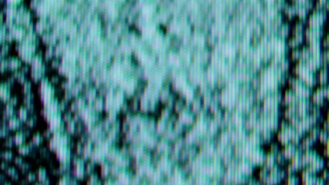 Pixels in the working old analog TV screen close up. Red, blue and green dot Stock Footage 145914368