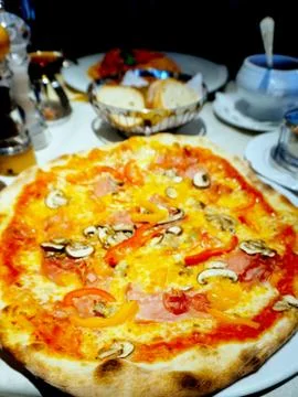 Piza on the table Stock Photos