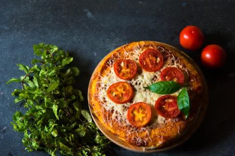 Pizza and condiments Stock Photos