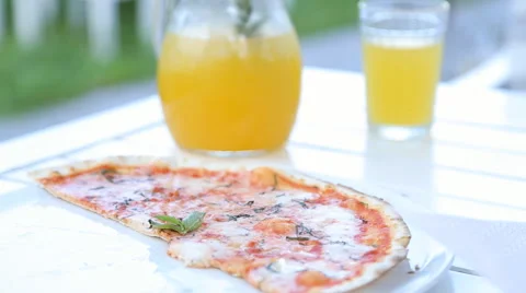 Pizza and juice on the table Stock Footage 66780444