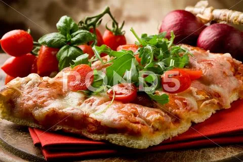 Pizza arugula and cherry tomatoes Stock Photos