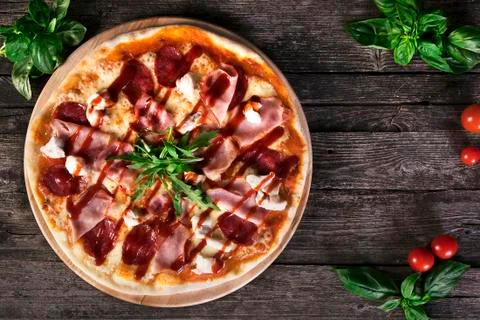 Pizza with bacon and tomato paste Stock Photos
