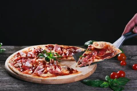 Pizza with bacon and tomato paste Stock Photos
