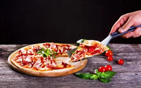 Pizza with bacon and tomato paste Stock Photos