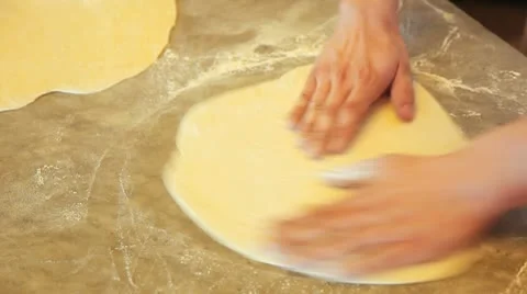 Pizza Baker preparing a pizza dough 動画素材 12444840