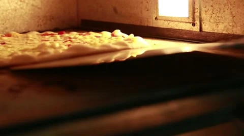 Pizza baking in the oven Stock Footage 52357286