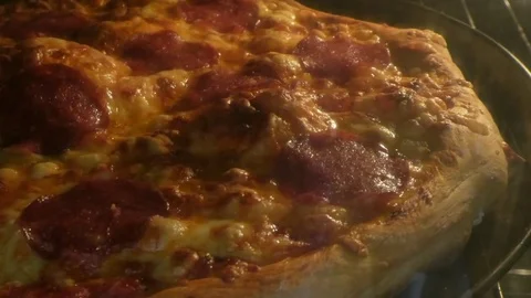 Pizza baking in oven Stock Footage 72458689