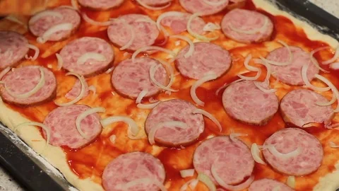 The pizza base. pizza cooking. put tomato in the pizza. arrange the ingredients 스톡 동영상 78589121