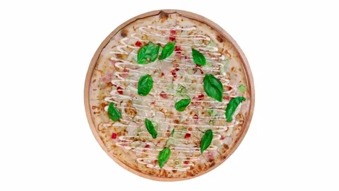 Pizza with basil cheese and ham rotating on white background 動画素材 248363603