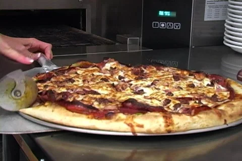 Pizza Being Cut Video stock 137026