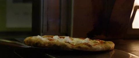 Pizza being kept in the oven for baking Stock Footage 103417870