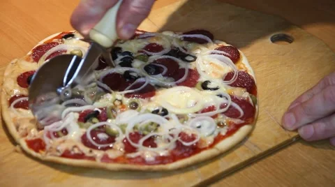 Pizza being sliced Video stock 58639201