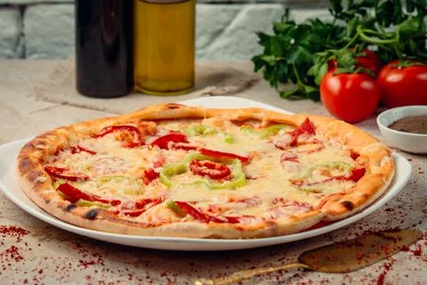 Pizza with bell pepper on the table ___ Stock Photos
