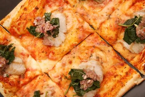 Pizza on the black background Stock Photos
