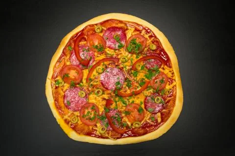 Pizza on a black background Stock Photos