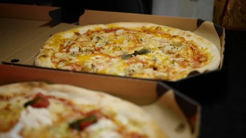 Pizza in a box close-up delivery slowmo Stock Footage 127541907