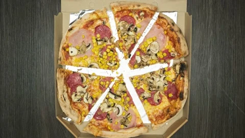 Pizza box moves, opens and pizza cuts into pieces. Stock Footage 195954607