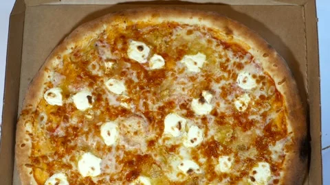 The pizza box is on the table and is later opened Video stock 270397470