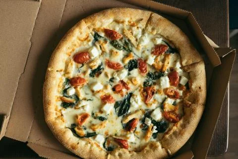 Pizza in box on table. Stock Photos