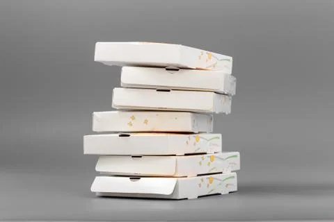 Pizza boxes on a gray background. Isolate Stock Photos