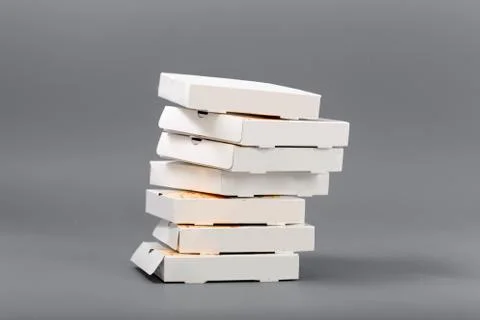 Pizza boxes on a gray background. Isolate Stock Photos