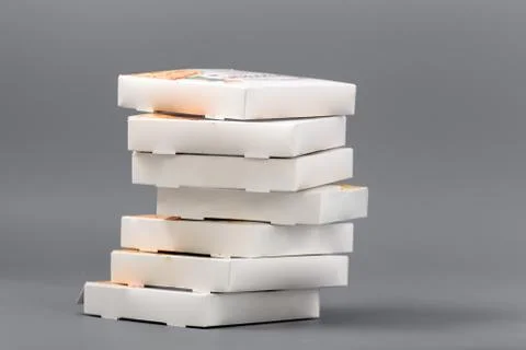 Pizza boxes on a gray background. Isolate Stock Photos