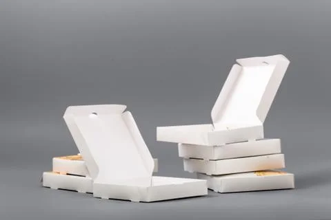 Pizza boxes on a gray background. Isolate Stock Photos