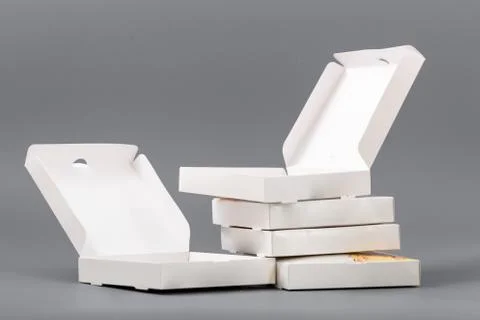 Pizza boxes on a gray background. Isolate Stock Photos