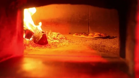 Pizza into brick oven Stock Footage 70235148