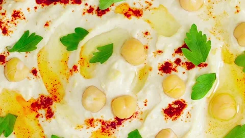 Pizza with cheese ham and basil, rotating, turning 動画素材 249583706