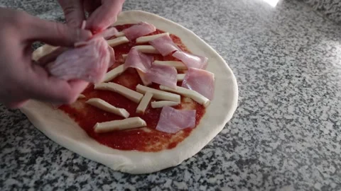 Pizza chef adding ham Stock Footage 296154493