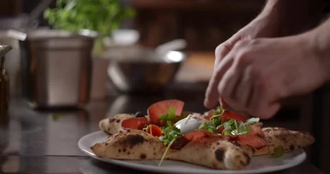 Pizza chef adds cherry tomatoes to the hot Neapolitan pizza Stock Footage 283548873