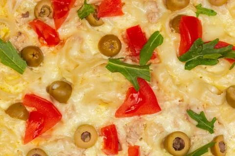 Pizza on chopped thin flatbread base, top view of fragment Foto stock